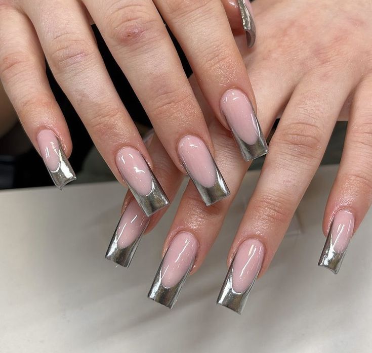 Chic Soft Pink Nails with Metallic Silver Tips: Elegant and Modern Style Statement.