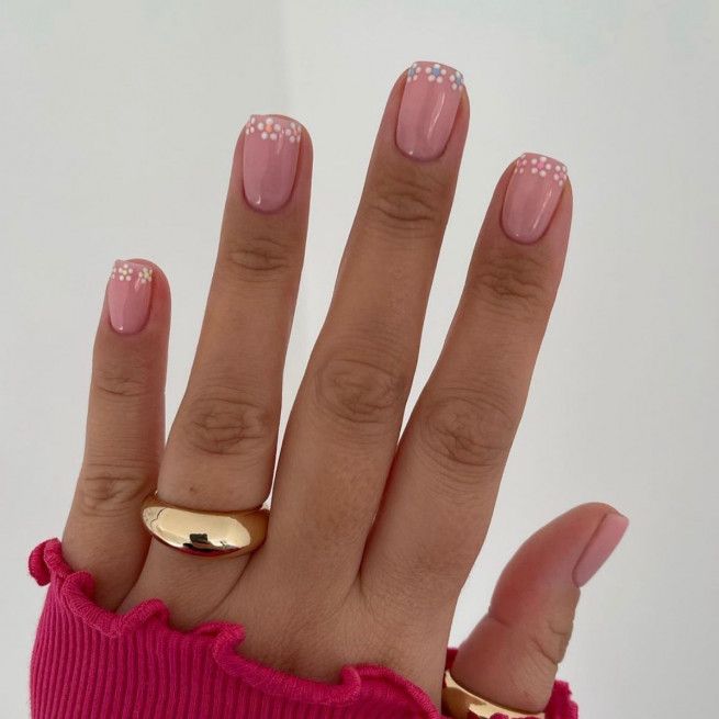 Elegant Chic Pink Manicure with White Polka Dots and Golden Accents