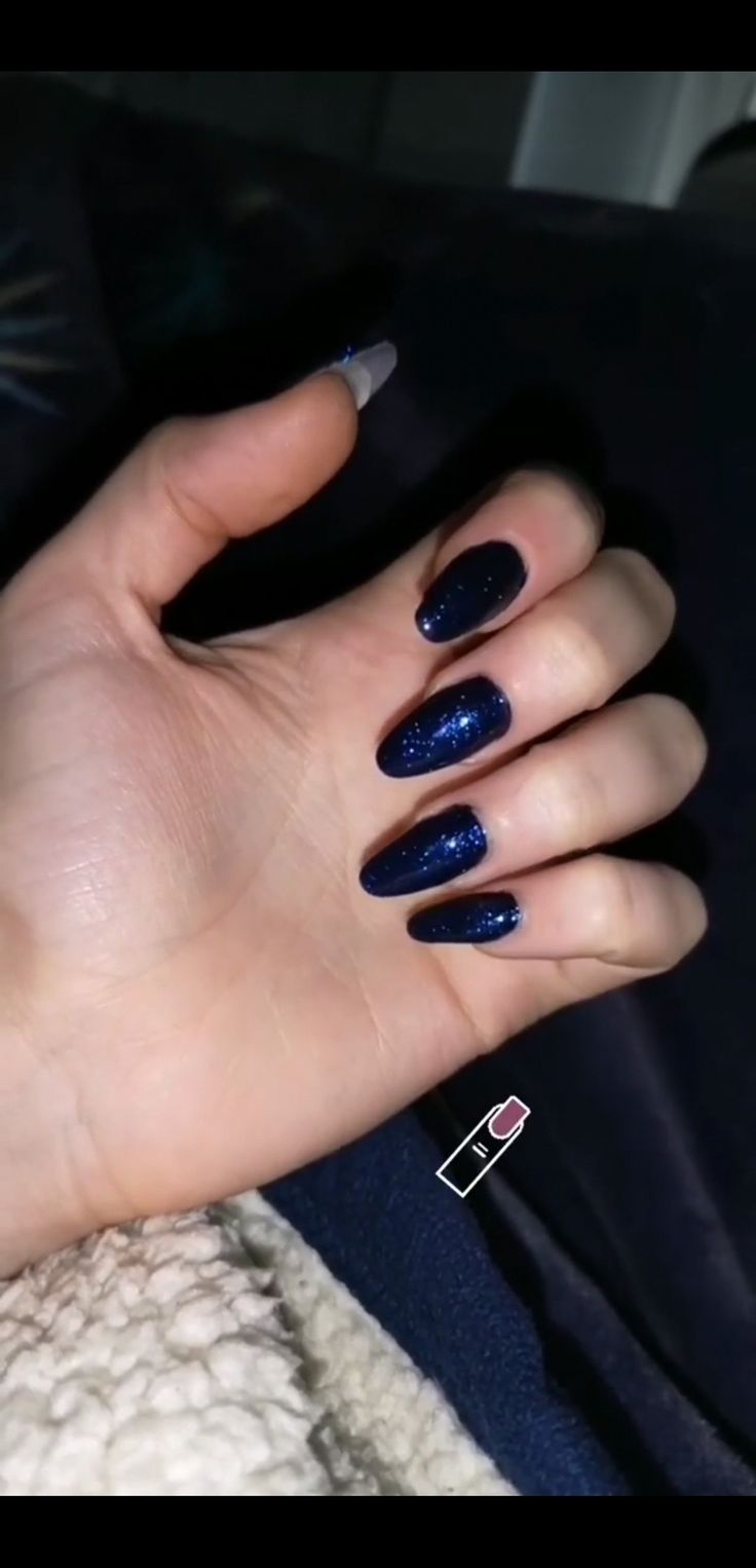 Elegant Dark Navy Blue Nail Design with Glossy Finish and Glitter Accents