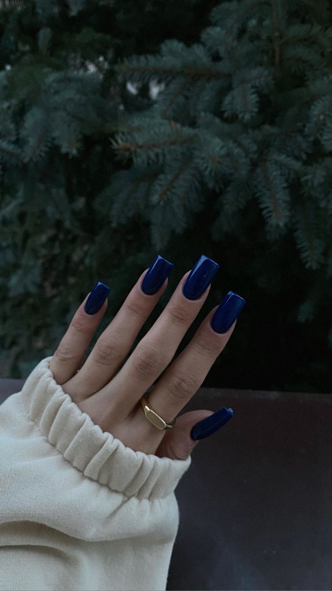 Elegant Deep Blue Glossy Nail Design with Long Square Shape for a Sophisticated Look.