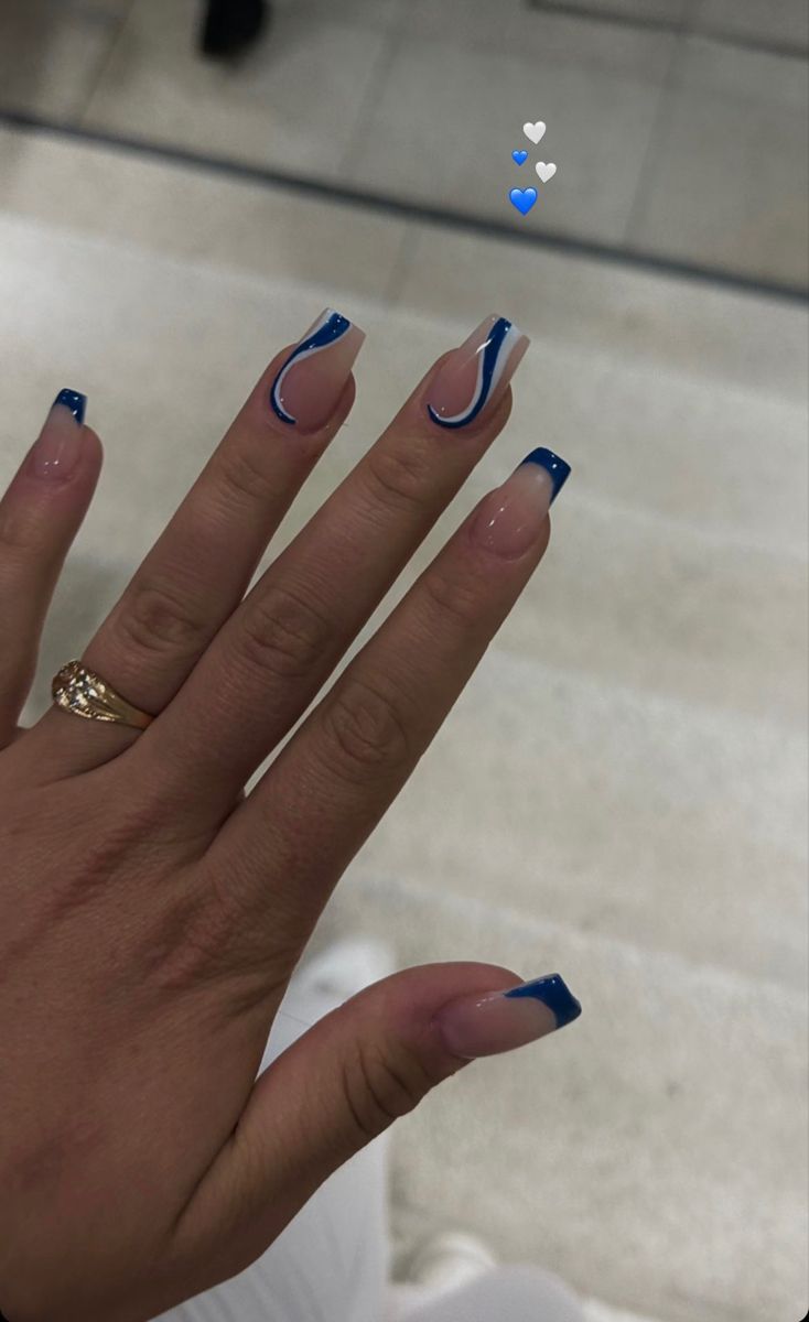 Sleek Nude Nail Design with Dynamic Blue Tips and Curves.