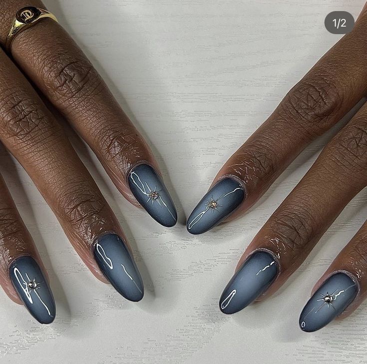 Elegant Ombre Nail Design: Deep Blue Gradient with White Art and Gold Accents