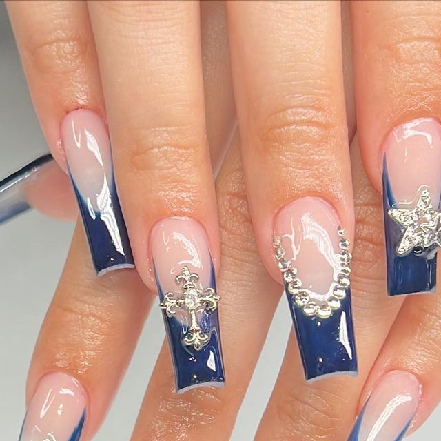 Chic Nail Art: Navy Blue and Sheer Design with Silver Accents and Modern French Tips.