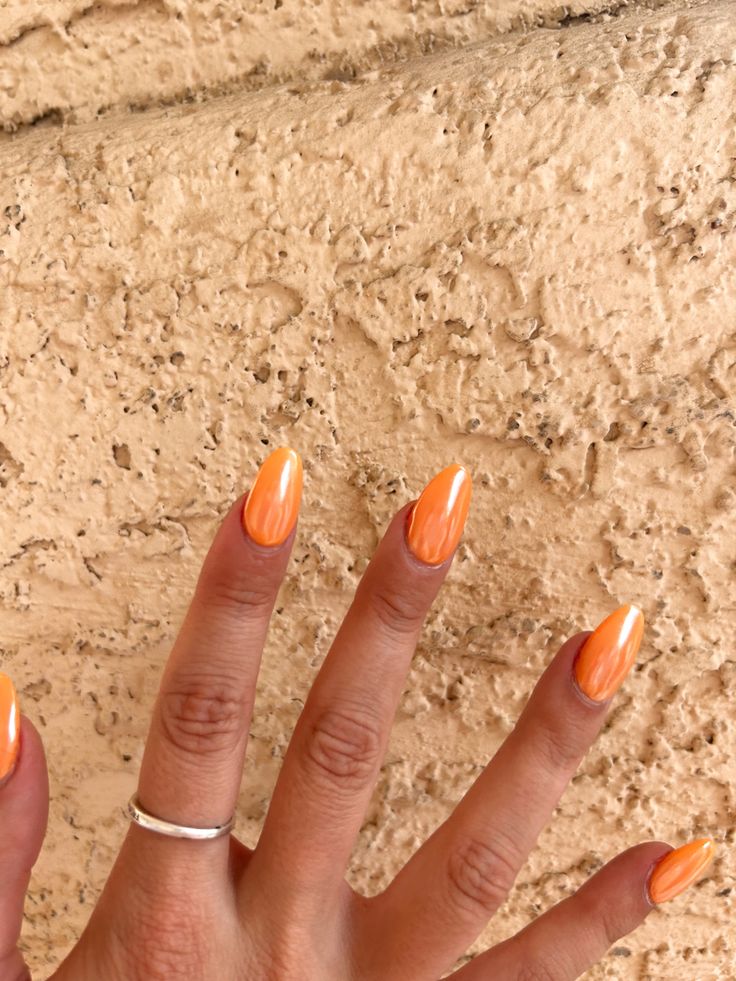 Vibrant Orange Pointed Nails: A Cheerful and Elegant Summer Statement