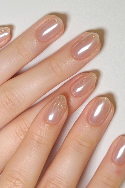 Refined Elegant Nude Nail Design with Glossy Finish and Subtle Shimmer.