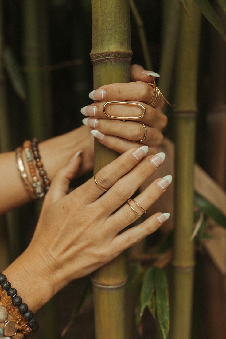 Chic French Tip Nail Design Harmonizes with Earthy Bamboo Setting