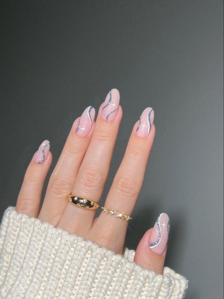 Chic Soft Pink Nail Design with Delicate Wavy Lines and Glamorous Sparkling Accents.