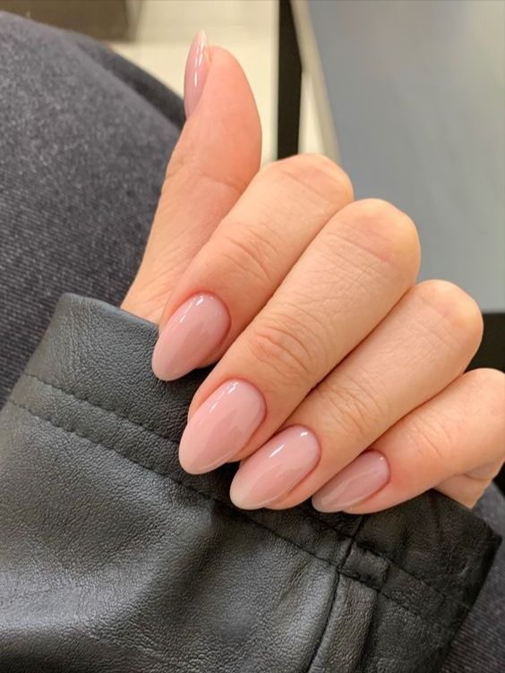 Sophisticated Almond-Shaped Nails with Soft Nude Polish: A Minimalist's Chic Choice