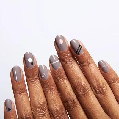 Modern Geometric Nail Design with Muted Gray Base and Contrasting Accents.