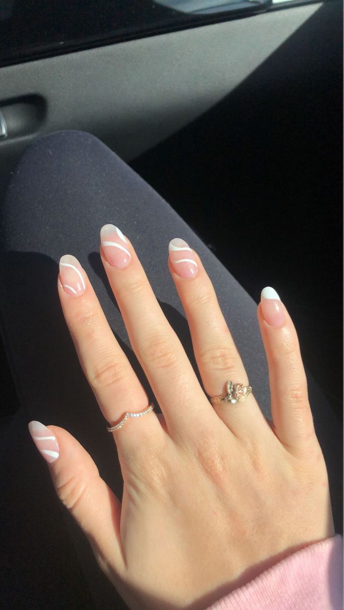 Chic Modern French Tip Nail Design with Negative Space and Delicate Accents.