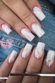 Chic Ombre Nails: Soft White to Delicate Pink with Intricate Silver Swirls