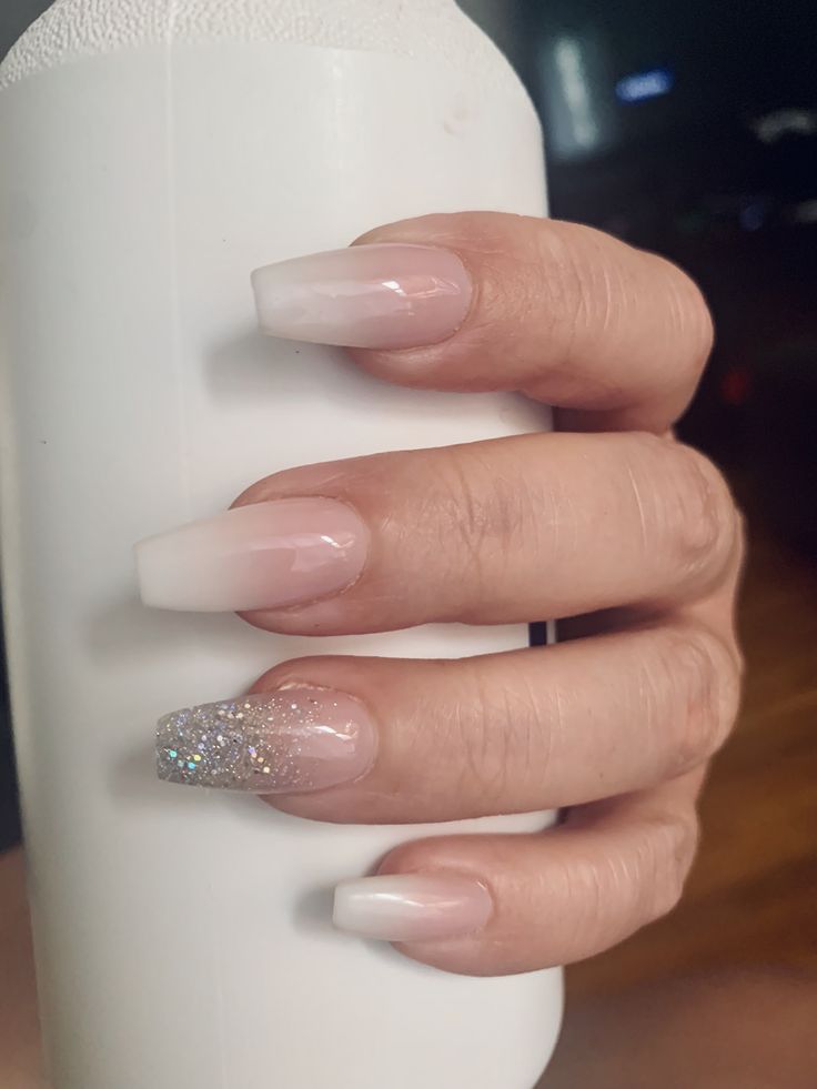 Sophisticated French Tip Ombre Nail Design with Glitter Accent