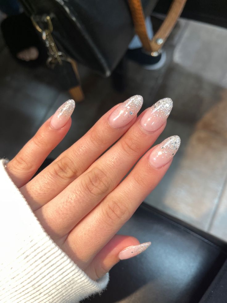 Chic Ombre Manicure: Sheer Pink Base with Sparkling Silver Tips