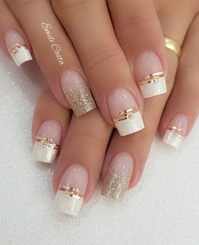 Sophisticated Nail Design: Soft Nude and Shimmering Gold with Sparkling Gradient and Elegant Accents.