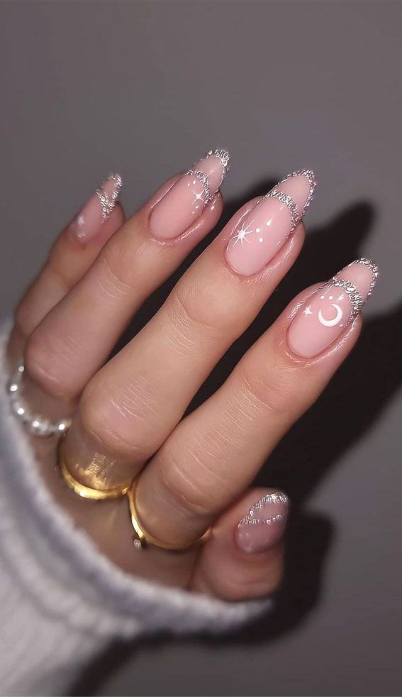 Chic French Tip Nail Design with Soft Nude Base and Celestial Silver Accents