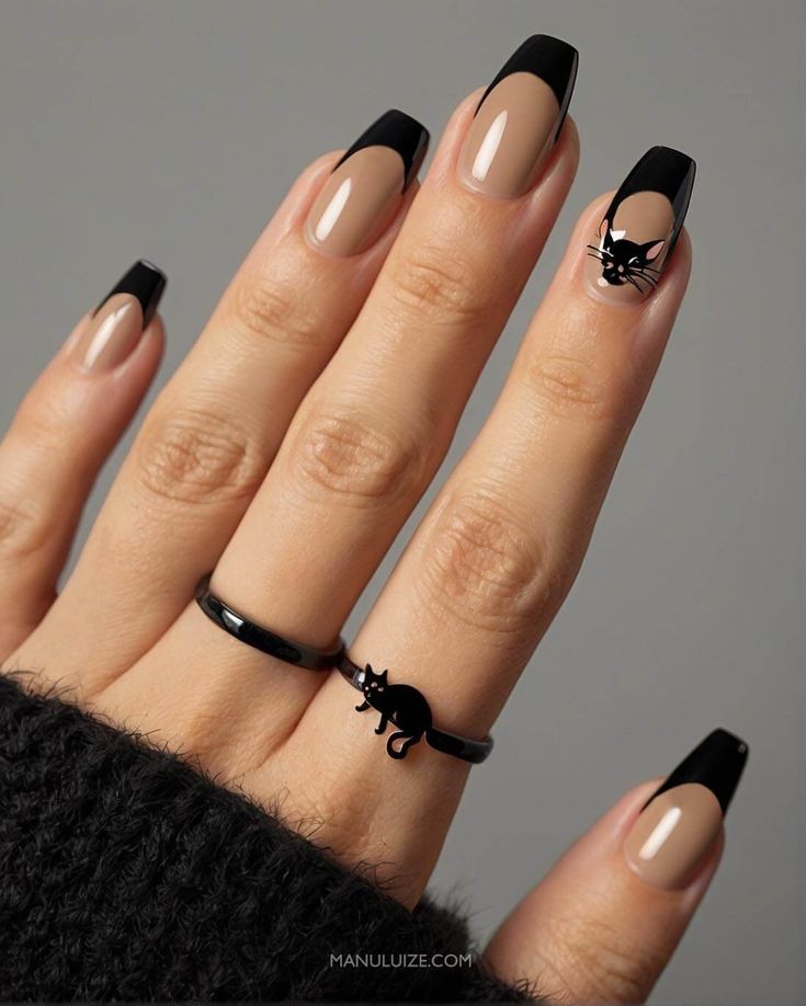 Chic Cat-Inspired Nail Design with Nude Base and Black Tips for Stylish Cat Lovers