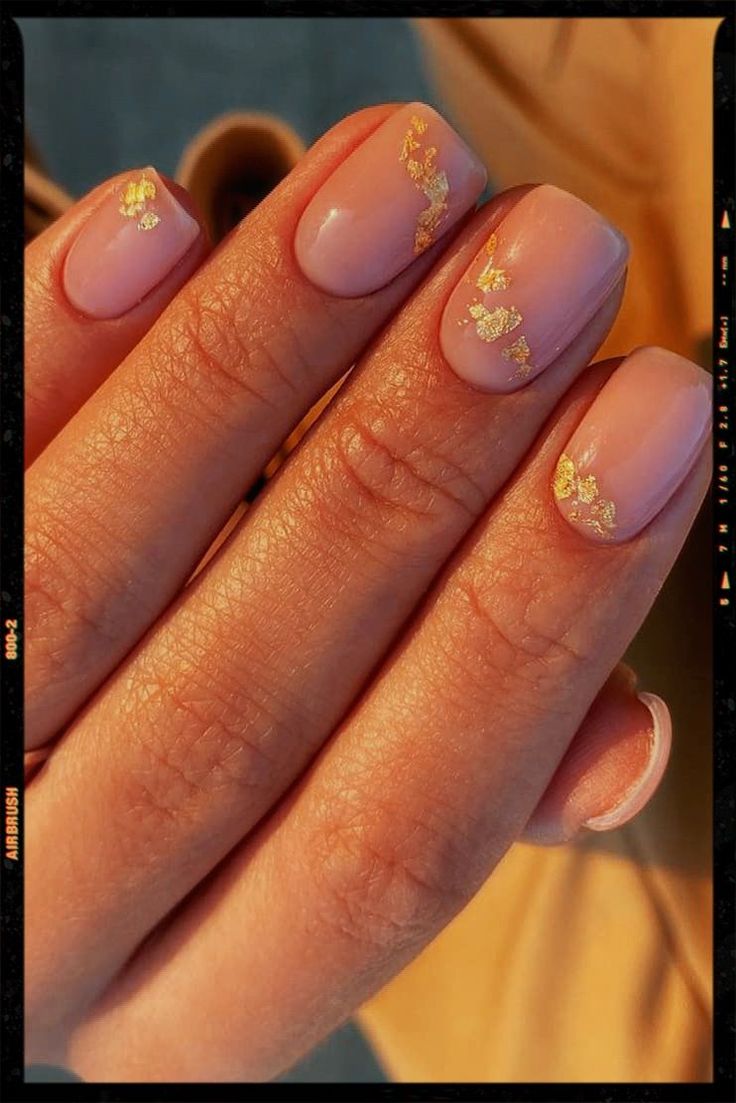 Elegant Soft Pink Nail Design with Gold Foil Accents.