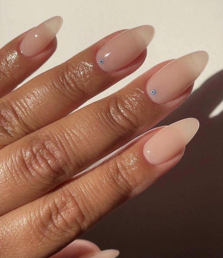 Chic Almond-Shaped Nails with Soft Ombre and Playful Blue Accents