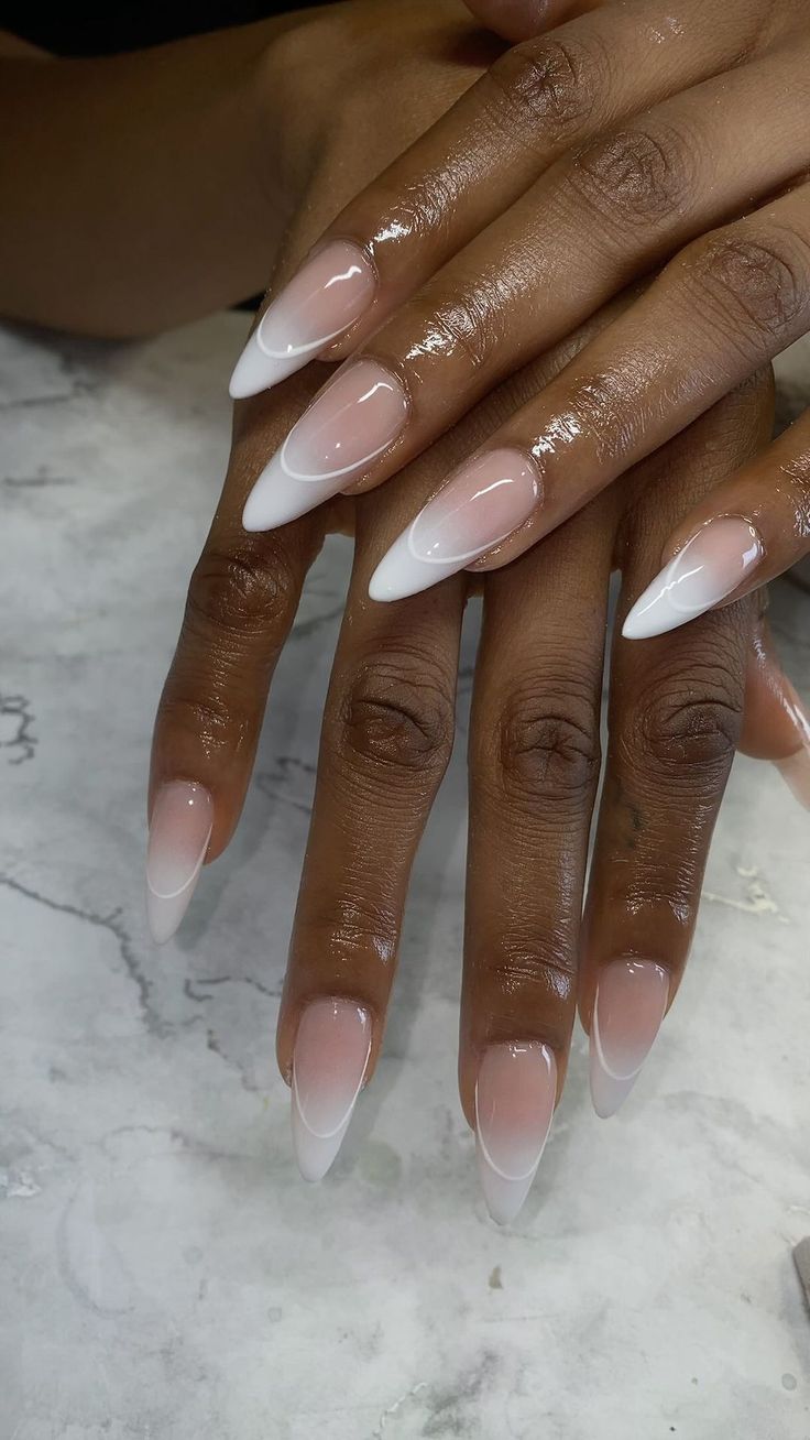 Chic French Ombre Nail Design: Sophisticated Almond Shape with Nude and White Gradient.