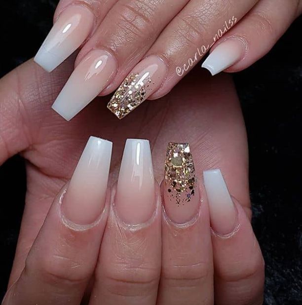 Elegant Ombre Nail Design with Nude and White Tones Accented by Gold Glitter.