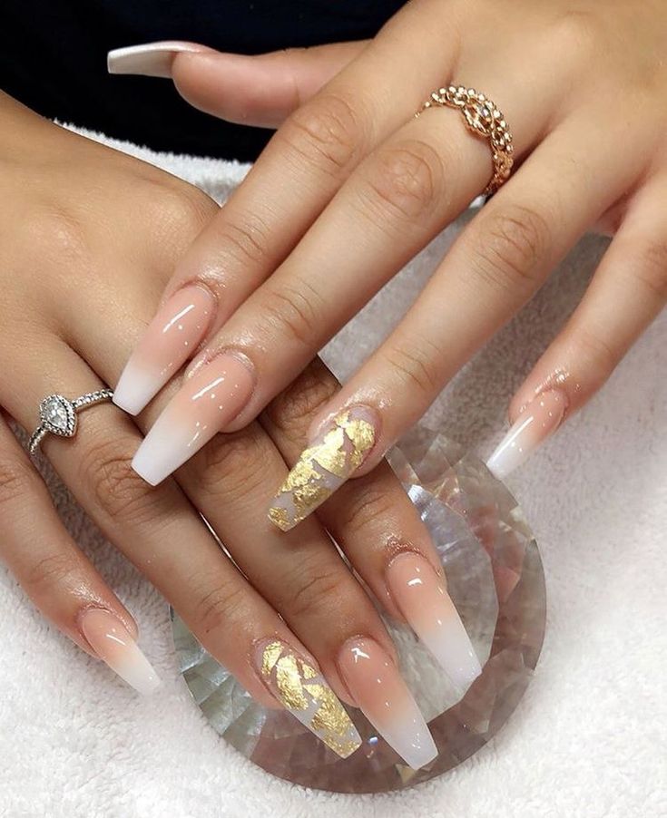 Sophisticated Stiletto Nail Design with Gradient Nude to White French Tips and Gold Foil Accent