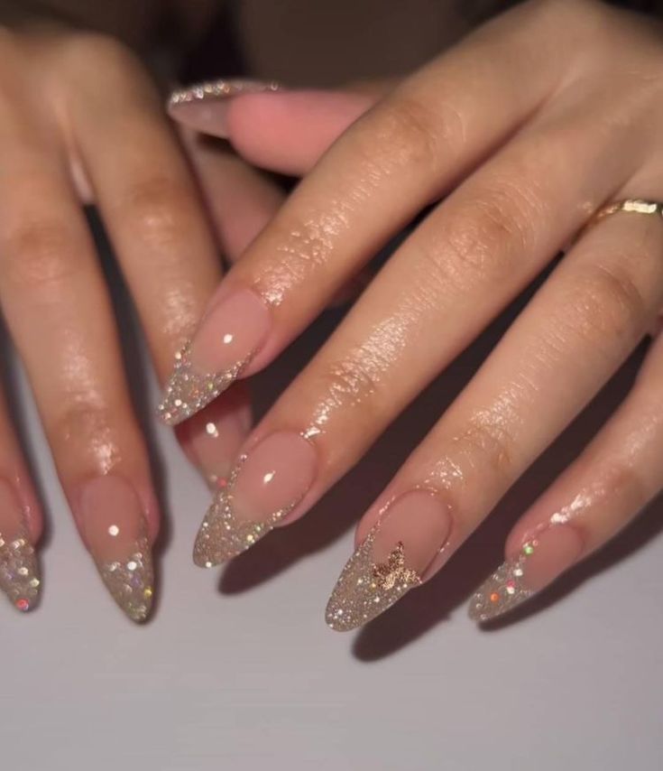 Chic Almond-Shaped Nails: Nude Base with Shimmering Gold Tips for Effortless Elegance