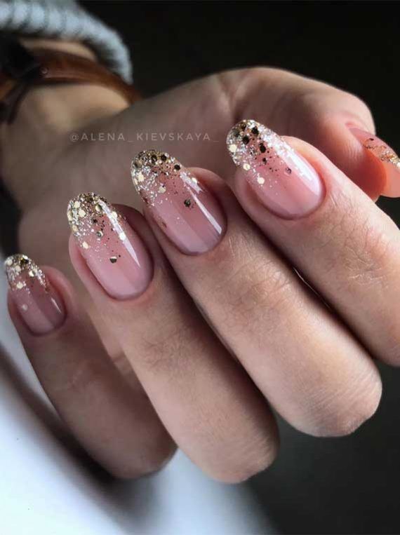 Chic Nude and Gold Glitter Nail Design for a Glamorous Touch.