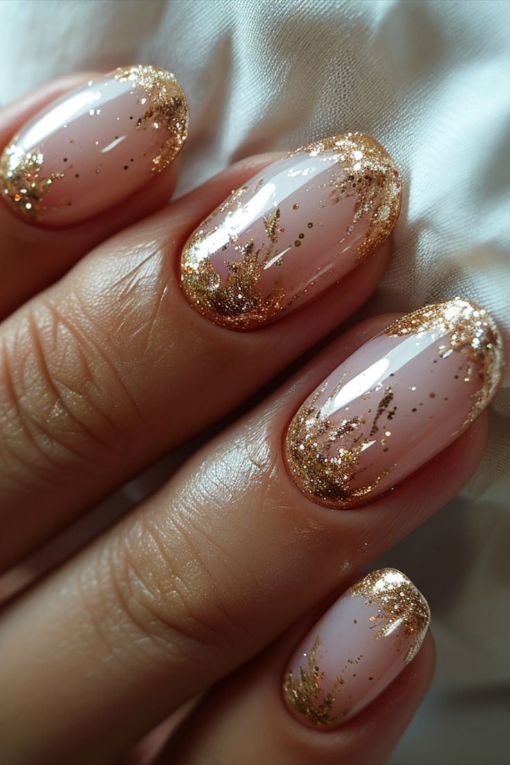 Sophisticated Soft Pink and Glittering Gold Nail Design for Chic Elegance.