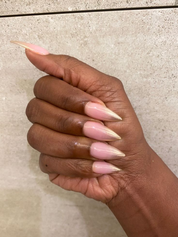 Chic Soft Pink Stiletto Nails with Elegant Nude Tips for a Bold yet Refined Statement.