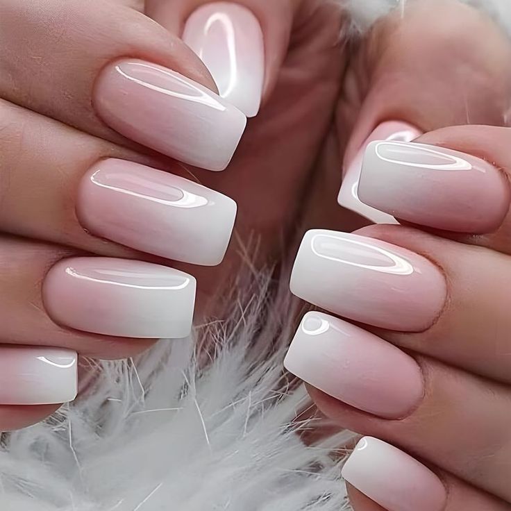 Elegant Ombre Nail Design: Soft Pink to White Gradient with Glossy Squared Tips.