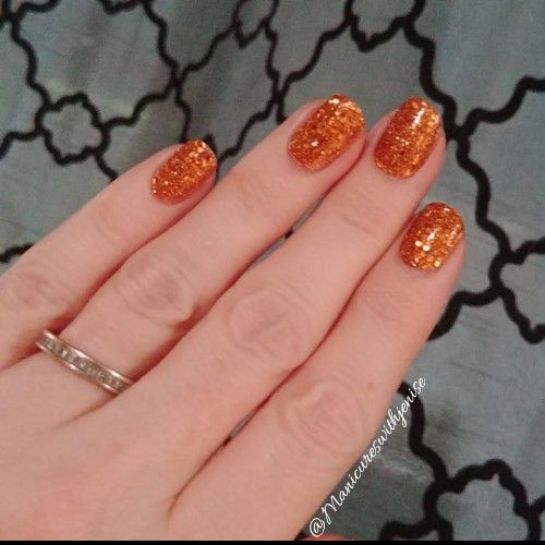 Dazzling Glistening Orange Glitter Nail Design for a Bold Glam Statement.