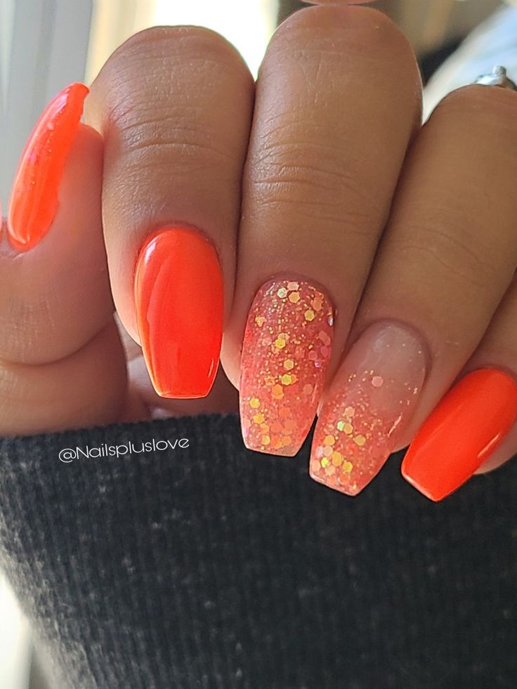 Bold Vibrant Orange Nails with Glossy Finish and Glitter Gradient Accent.