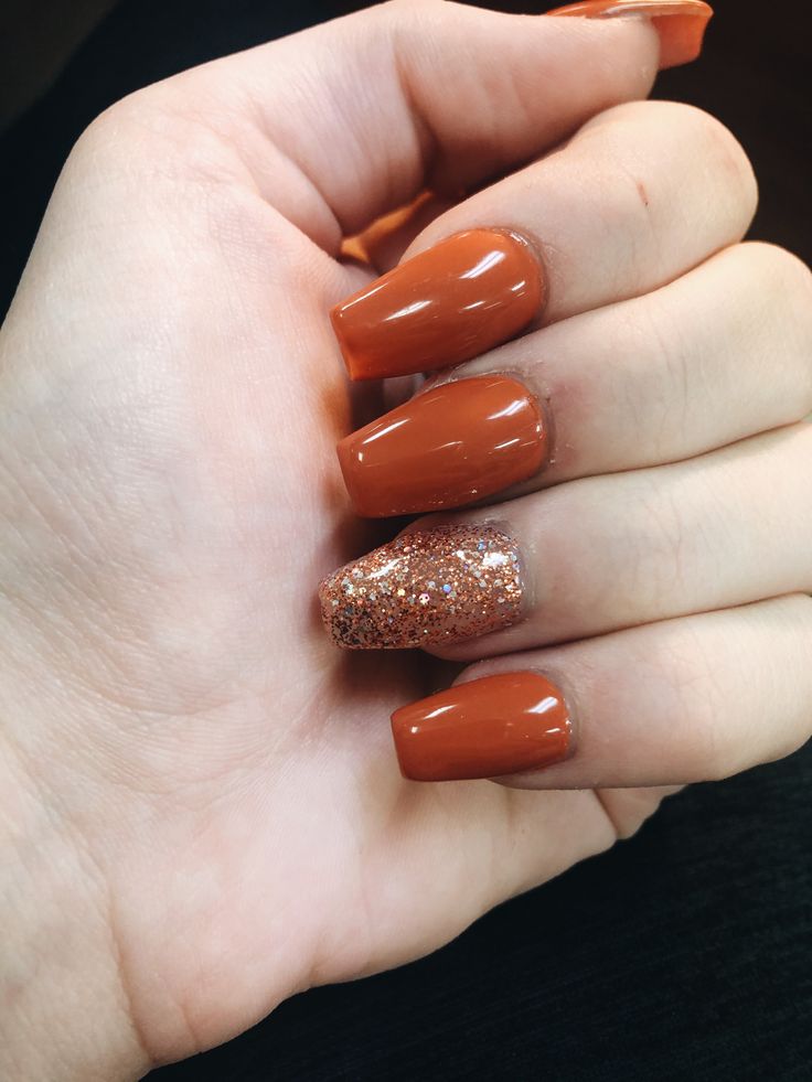 Vibrant Orange and Glitter Accent Nails for a Playful Yet Sophisticated Look.