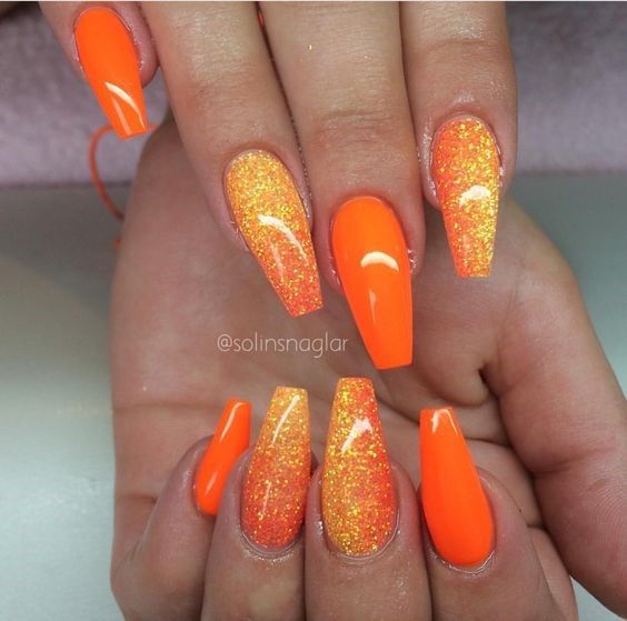 Bold Orange Glossy Nails with Glitter Gradient for Eye-Catching Summer Glamour.