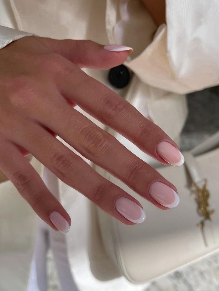 Chic Oval Nail Design: Soft Pink Base with Elegant White Tips