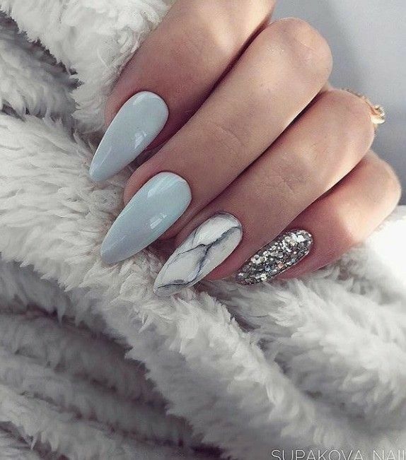 Sophisticated Nail Design: Pastel Blue and Marble with a Glam Glitter Accent