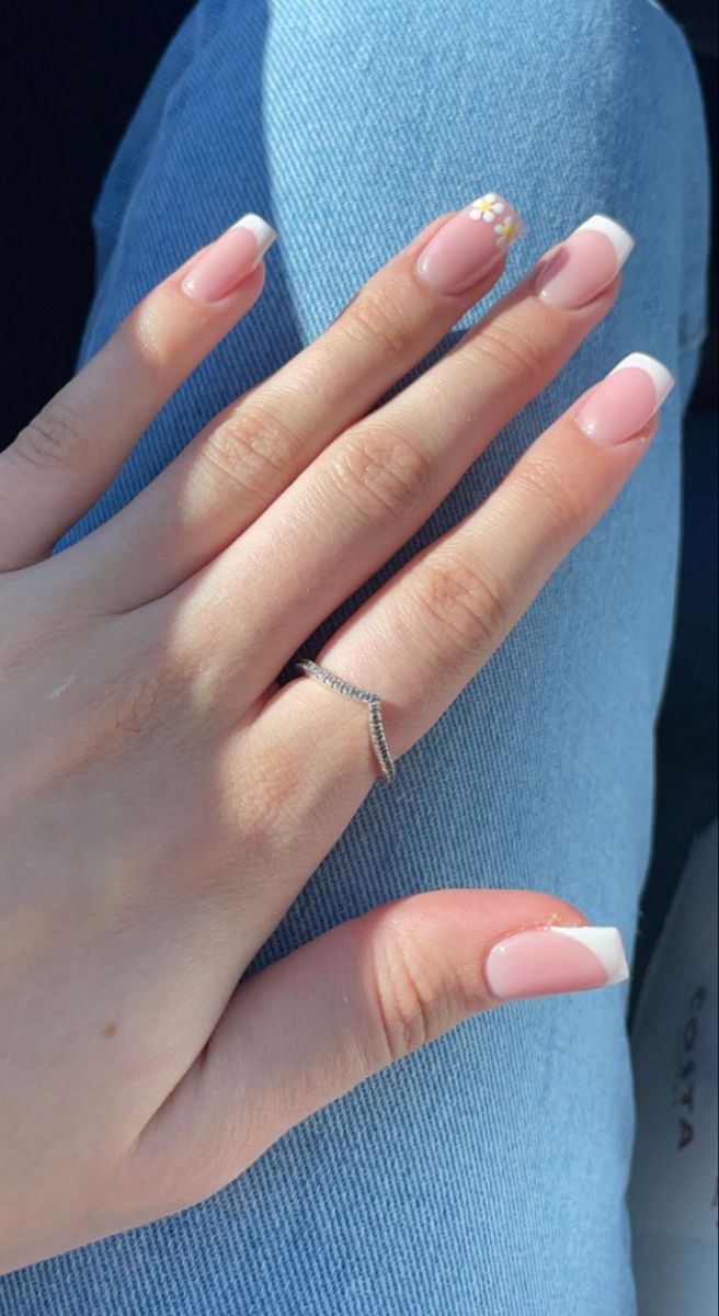 Elegant French Tip Manicure with Floral Accents for Versatile Styling