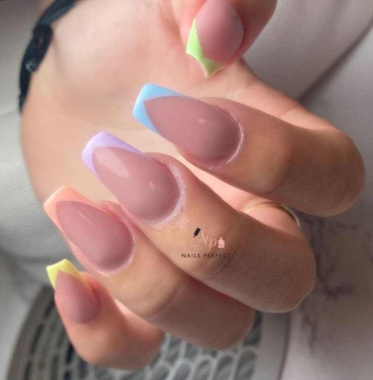 Chic Pastel Nail Design: Elegant Nude Base with Playful Geometric Tips