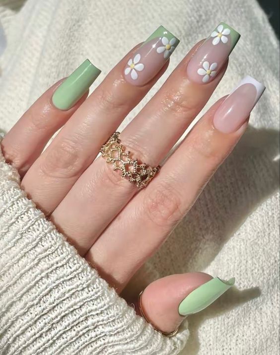 Whimsical Spring Nail Design with Pastel Greens, Soft Pinks, and Delicate Floral Accents.