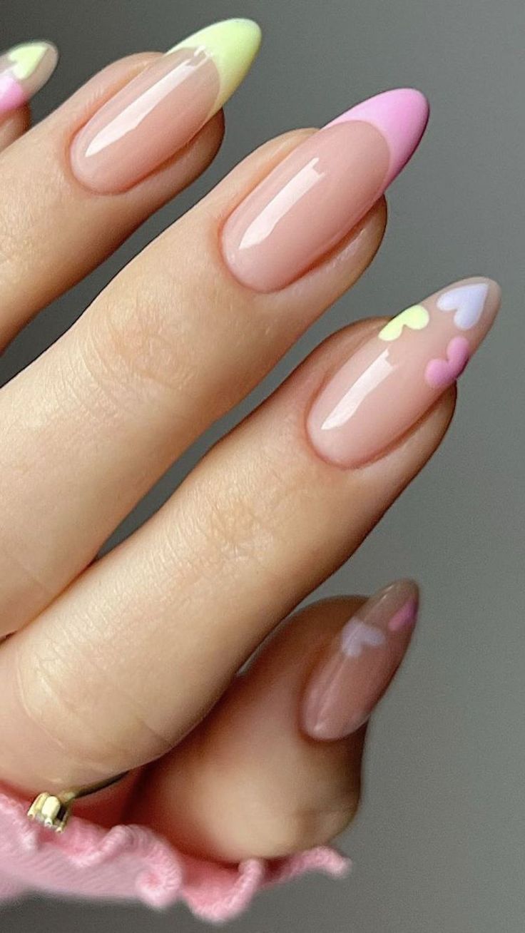 Whimsical Pastel Nail Art with Heart Accents and Glossy Finish