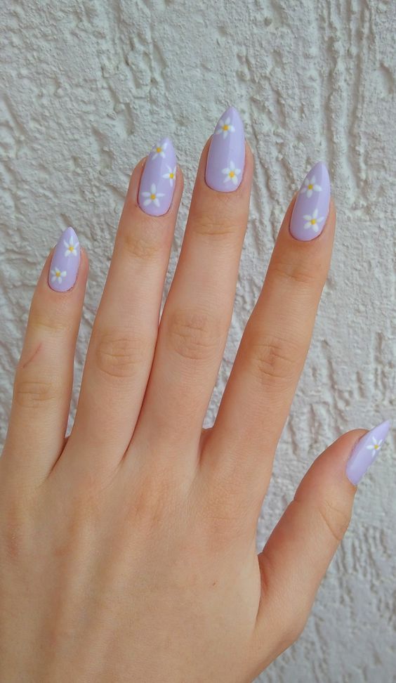 Charming Pastel Lavender Nails with Feminine Floral Accents for a Stylish Spring/Summer Look