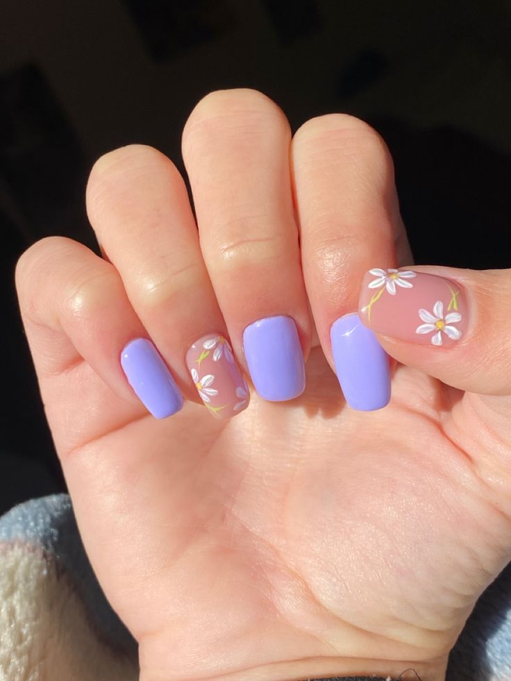 Elegant Spring Floral Nail Design with Soft Lavender Base and Charming White Accents.