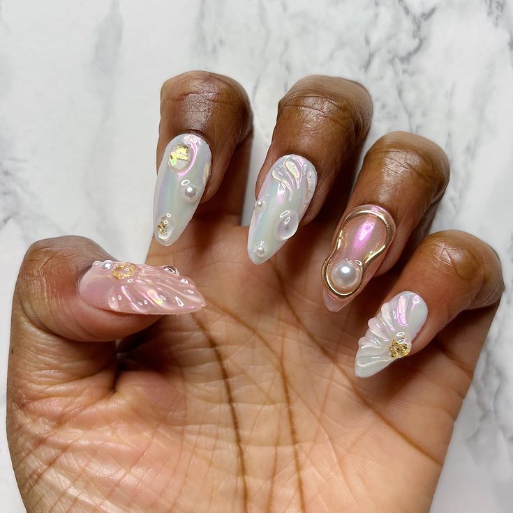 Sophisticated Pearlescent Nail Design with Iridescent Accents and Gold Details.