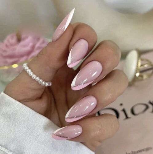 Chic Elegant Almond-Shaped Nails: Soft Pink Base, White Tips, and Glitter Accent.