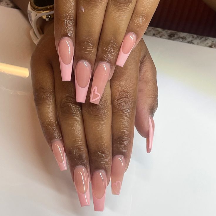 Playful Elegance: Soft Pink Ombre Nails with Heart Accents