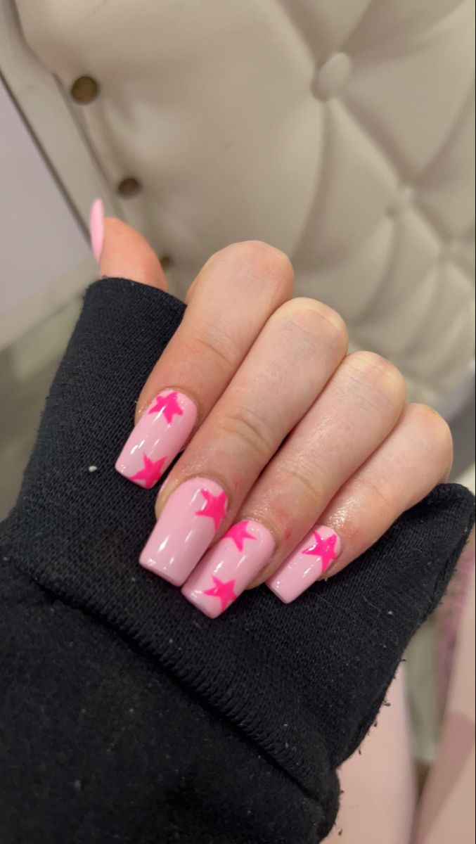 Playful Pink Nail Design: Glossy Finish with Star Motifs