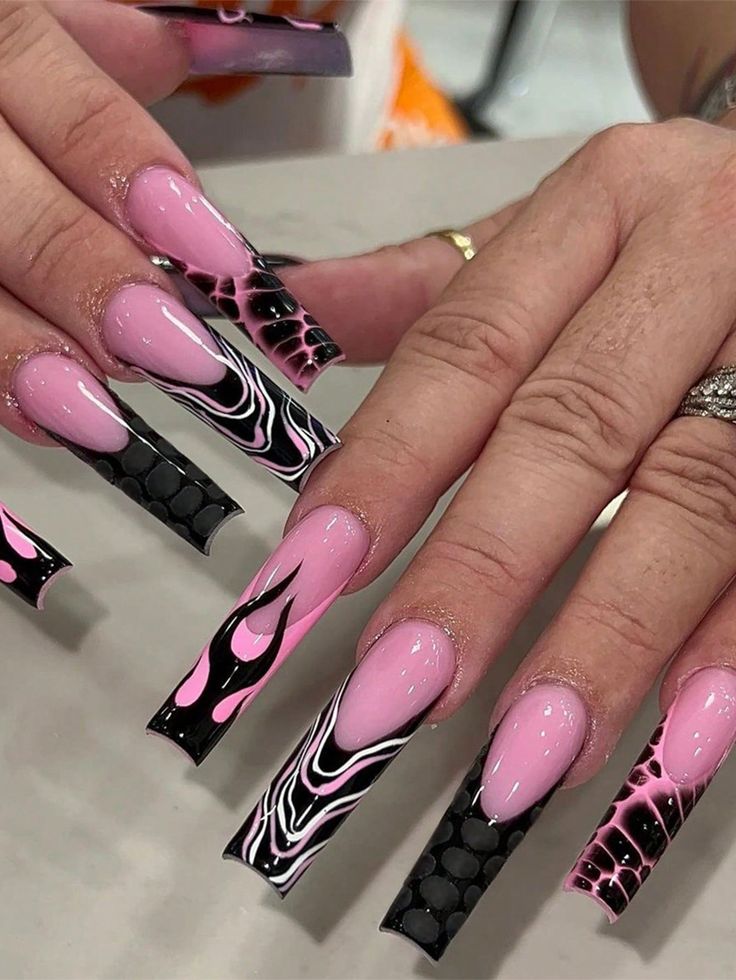 Chic Pink and Black Nail Design with Bold Abstract Patterns and Glossy Finish.