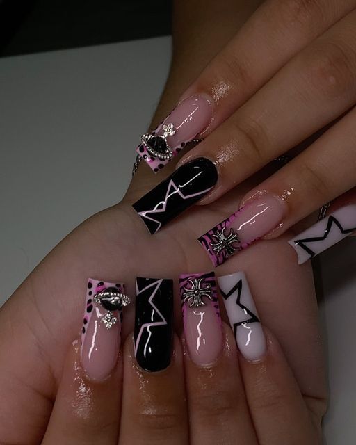 Chic Colorful Nail Design with Geometric Patterns and Elegant Embellishments.