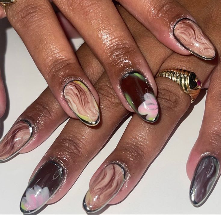 Elegant Floral-Inspired Nail Design with Earthy Tones and Glossy Finishes