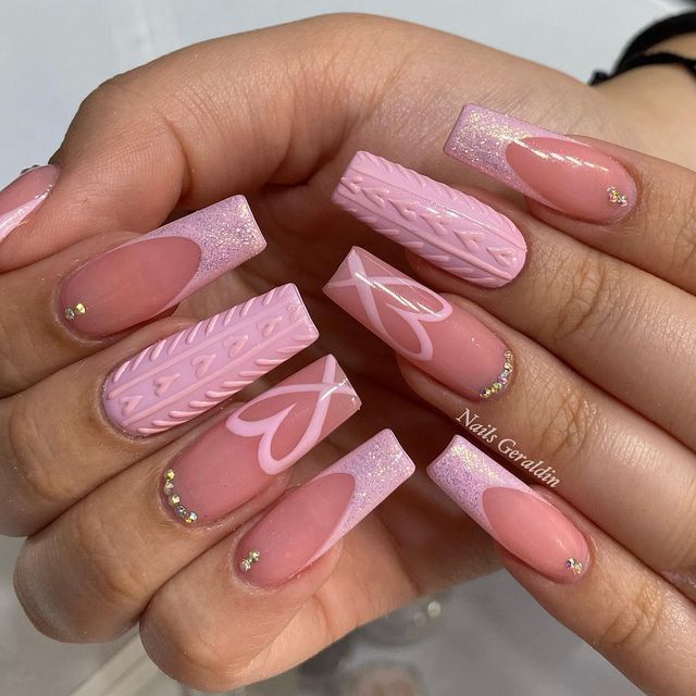 Chic Pink Nail Design with Textures, Patterns, and Sparkling Details.